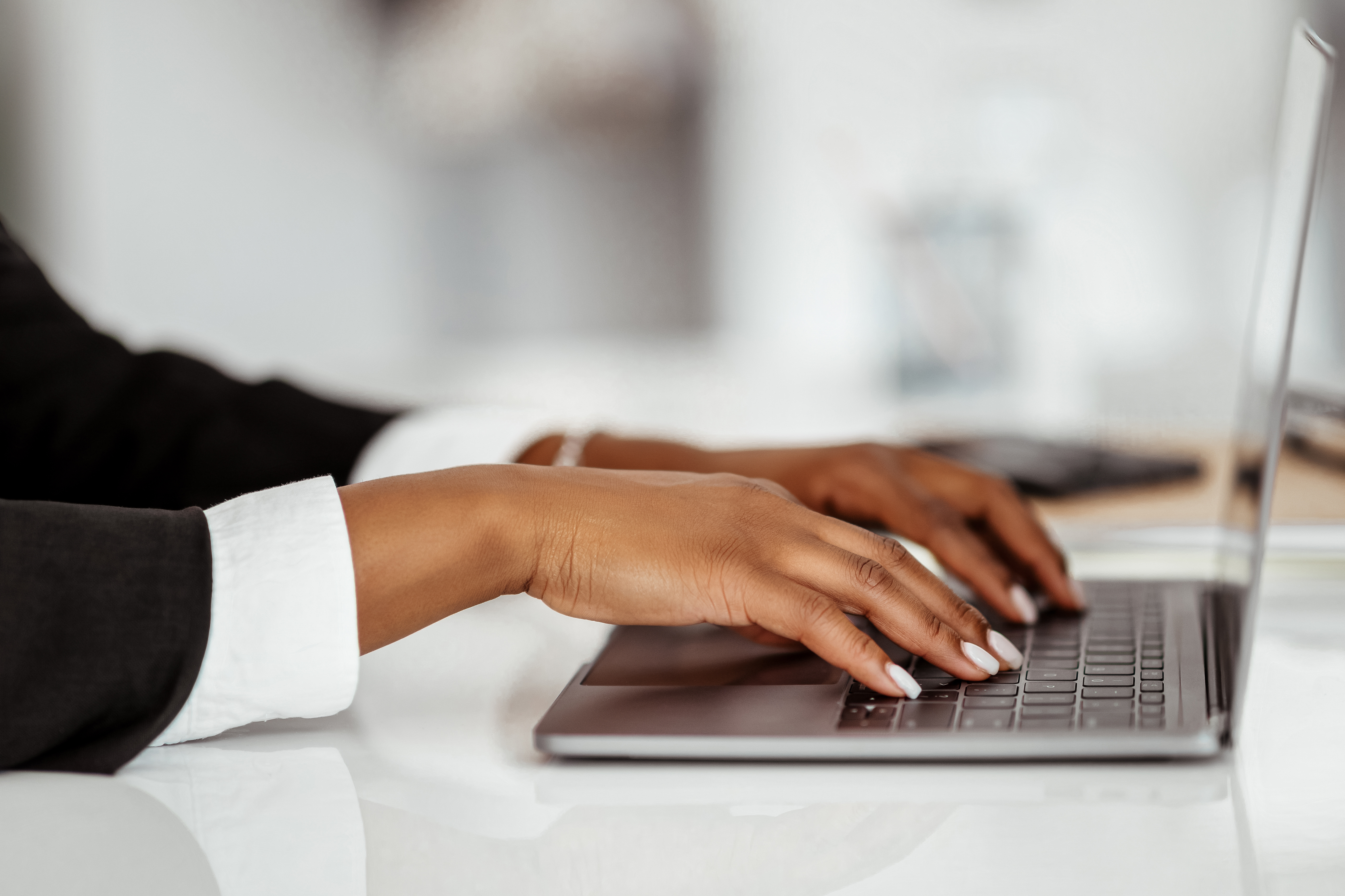 closeup-of-black-businesswoman-using-laptop-typin-2025-03-18-18-20-06-utc